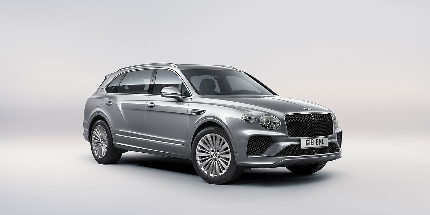 Bentley High Wycombe Bentley Bentayga Extended Wheelbase luxury SUV front three quarter view in Moonbeam paint with 21 inch five spoke painted wheels