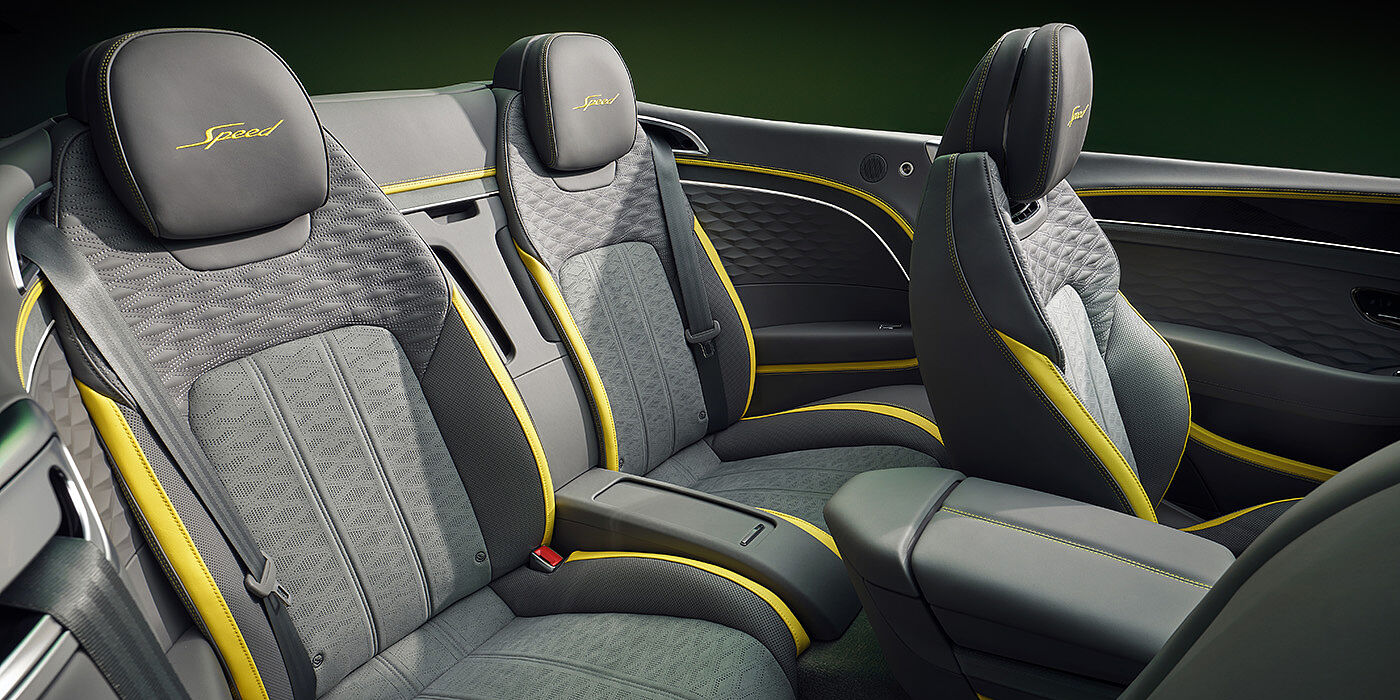 Bentley High Wycombe Bentley New Continental GTC Speed convertible rear interior with unique Speed colour split in Gravity Grey and Cyber Yellow hide colours, and contrast stitched headrest emblems 