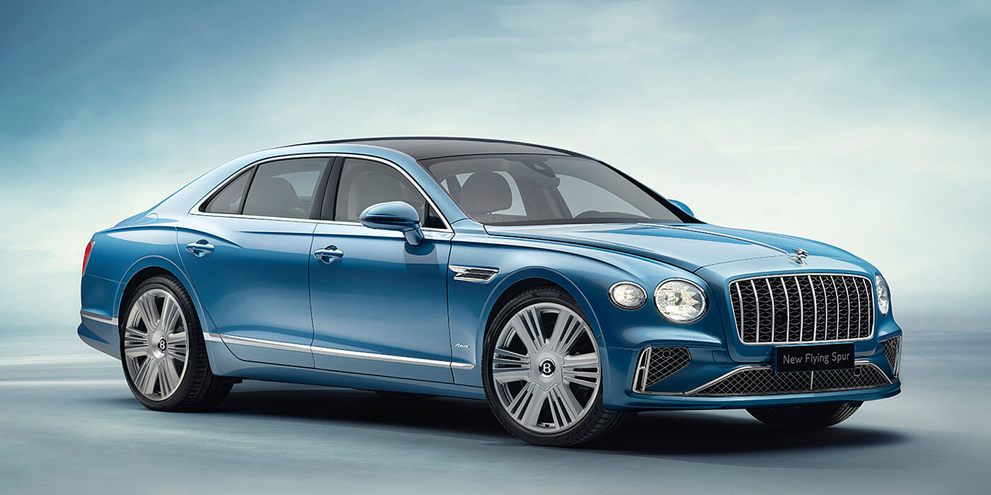 Bentley High Wycombe New Bentley Flying Spur Azure sedan front view in Light windsor blue by Mulliner paint with 22 inch Azure wheels and chrome exterior details