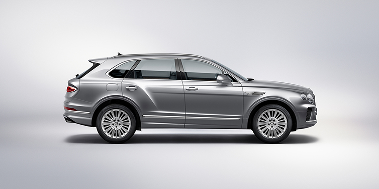 Bentley High Wycombe Bentley Bentayga SUV side profile in Moonbeam silver paint against white background featuring 21 inch 5 spoke wheels