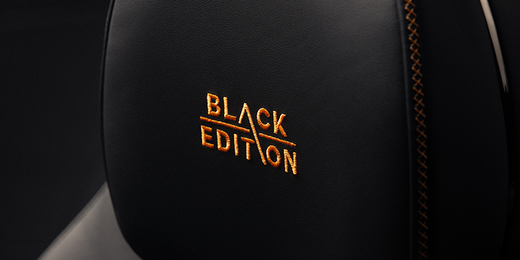 Bentley High Wycombe Bentley Continental GT coupe seat headrest Black Edition stitched emblem in Mandarin colour against Beluga black hide